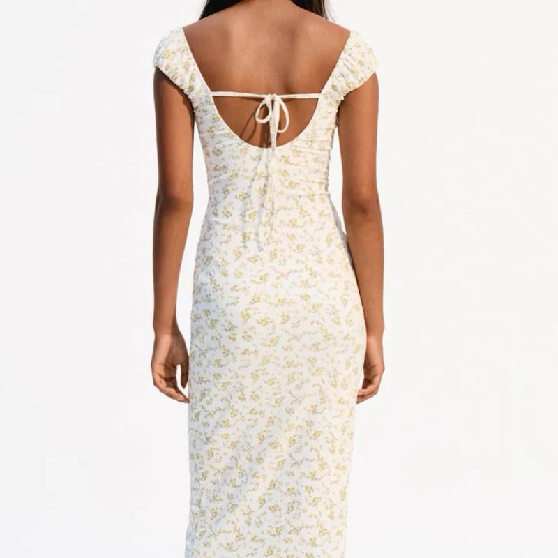 Vestido flores amarillas Bershka