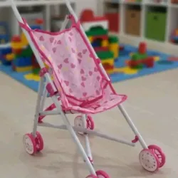 Coche métalico para muñecas.