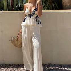 Conjunto de pantalón y blusa blanco con estampado negro