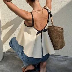 Top beige con lazo detrás y borde negro