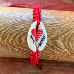 Pulsera tejida+caracol