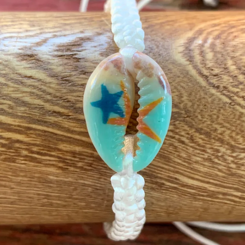Pulsera tejida+caracol