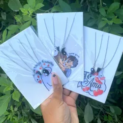 Pareja de cadenas yin yang y corazón imantado