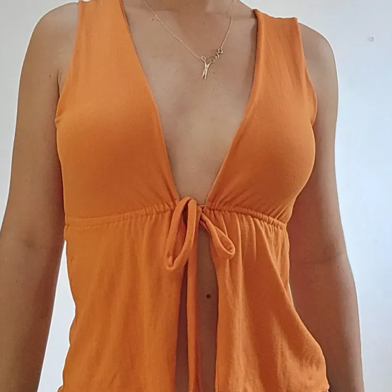 CAMISETA C/ VUELOS NARANJA
