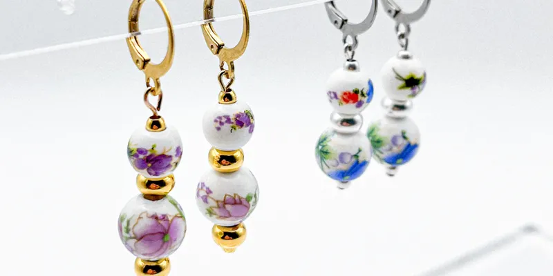 Aretes con entrepiezas de porcelana y separadores de acero inoxidable 