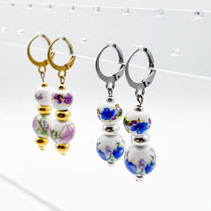 Aretes con entrepiezas de porcelana y separadores de acero inoxidable 