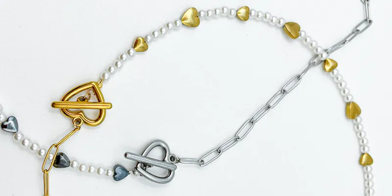 Collar de cadena de acero inoxidable, perlas artificiales y entre piezas de hematita 