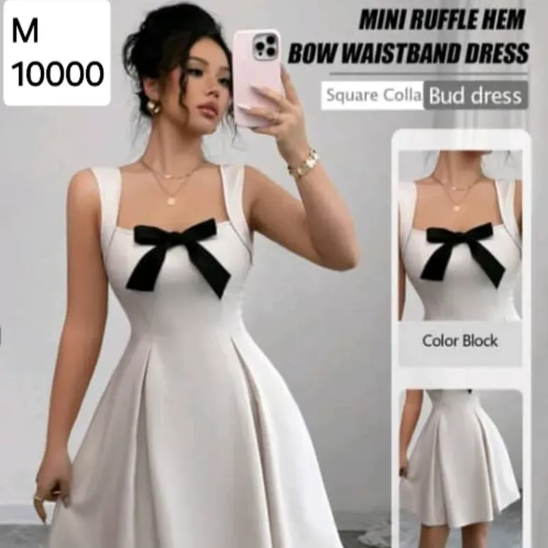 Vestido beige con lazo negro