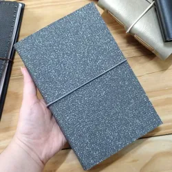 Cuaderno gris de brillo