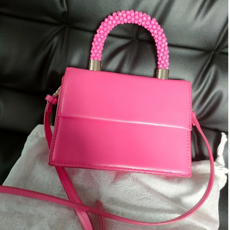 Cartera pequeña rosada Zara