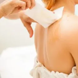 Back hair removal with wax