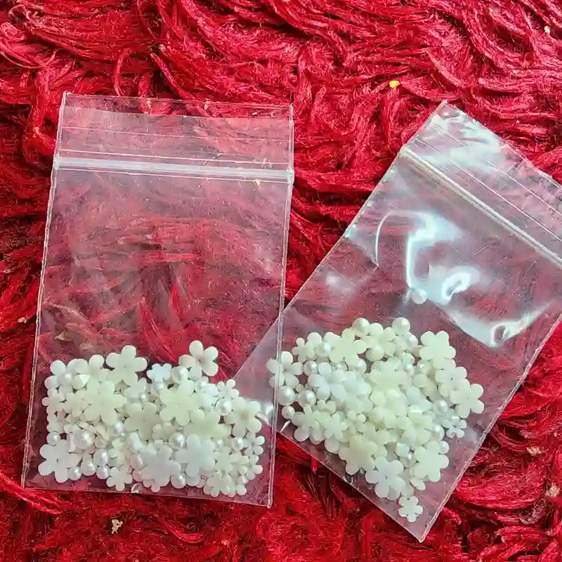 Paqueticos de flores de recina blanca