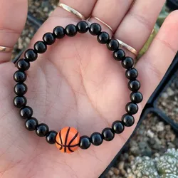 Pulsera con pelota.