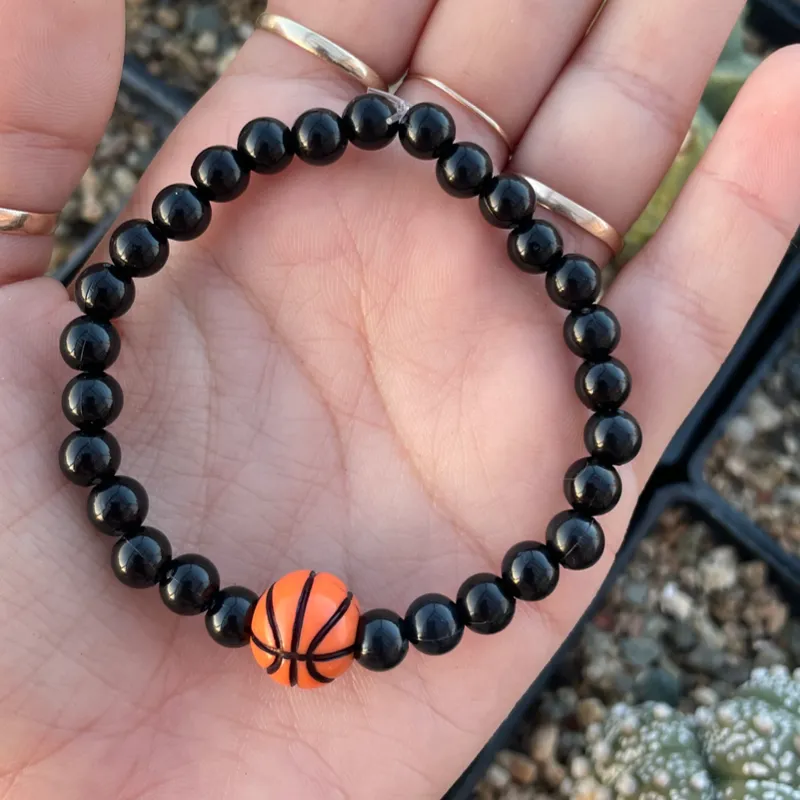 Pulsera con pelota.