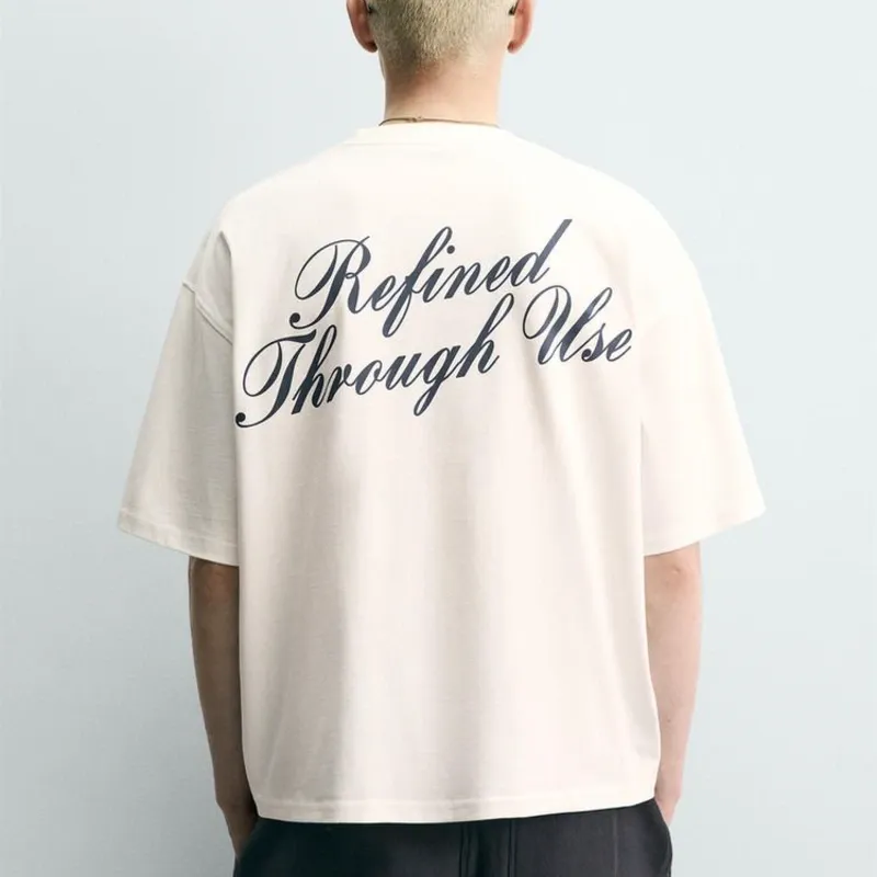 CAMISETA RELAXED FIT TEXTOS ESTAMPADOS