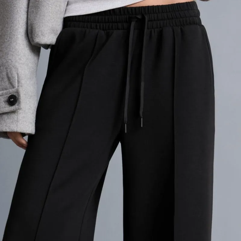 Conjunto abrigo suéter y pantalón