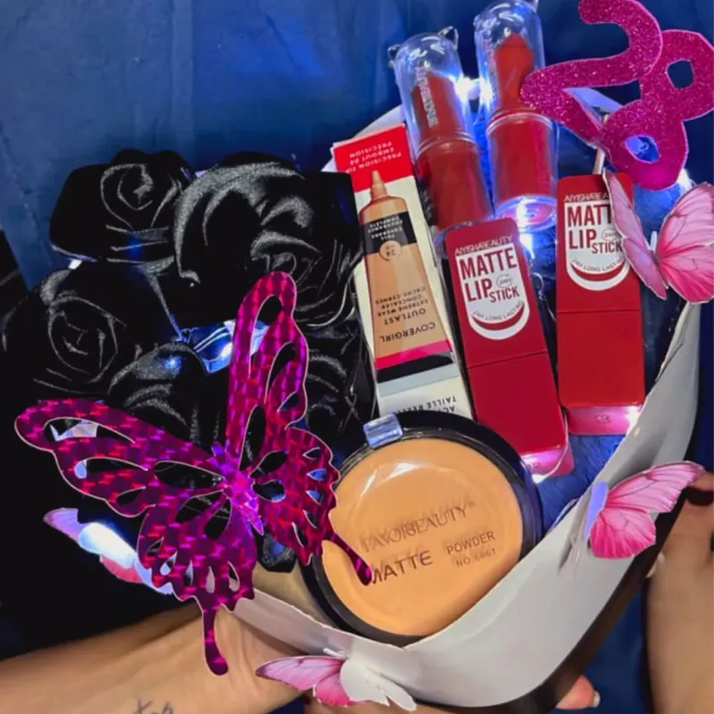 Caja de flores y maquillajes