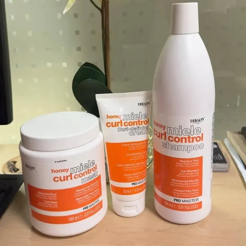 Juego de shampoo, tratamiento y crema de peinar Dikson de definición de rizos 