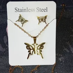 Conjunto con diseño de mariposa dorado